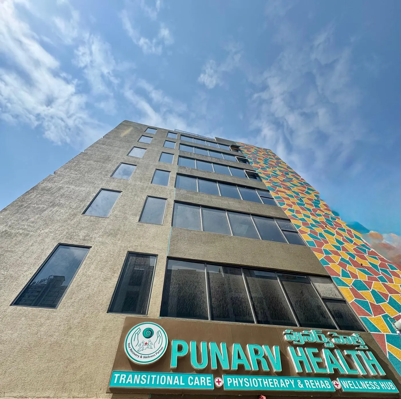 The mosaic-tile facade at Punarv Health's entrance